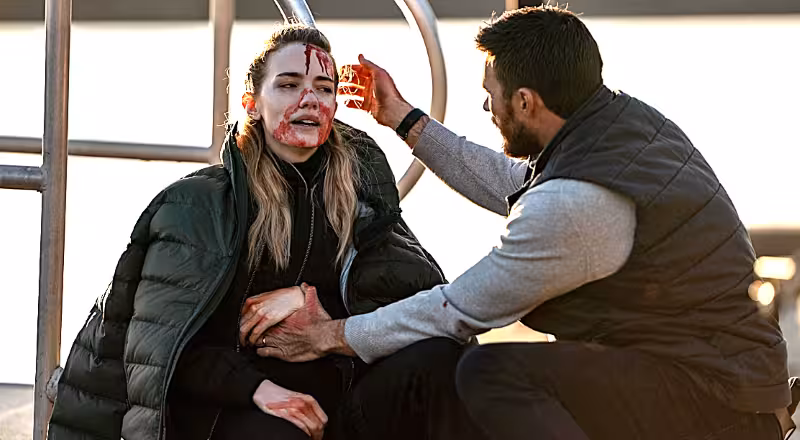 Scott Eastwood and Willa Fitzgerald as Joe Travers and Lara Travers in Alarum (2025)